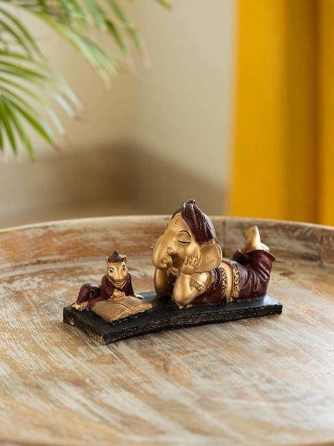 ExclusiveLane Brown & Golden Resin Reading Ganesha Idol