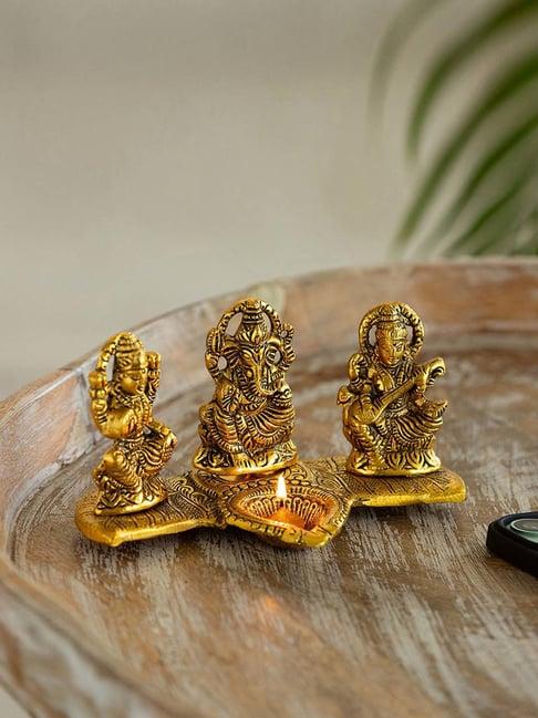 ExclusiveLane Golden Aluminium Laxmi Ganesh & Saraswati Idol With Diya