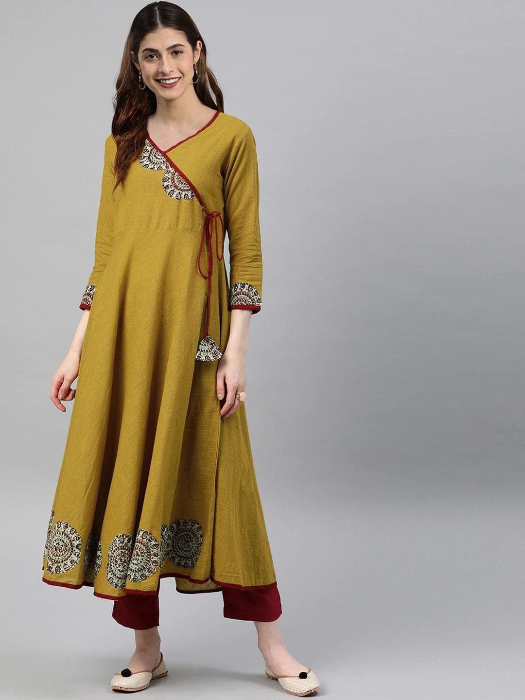 KALINI Women Mustard Yellow Floral Printed Angrakha Anarkali Kurta with Tassel Tie-Up