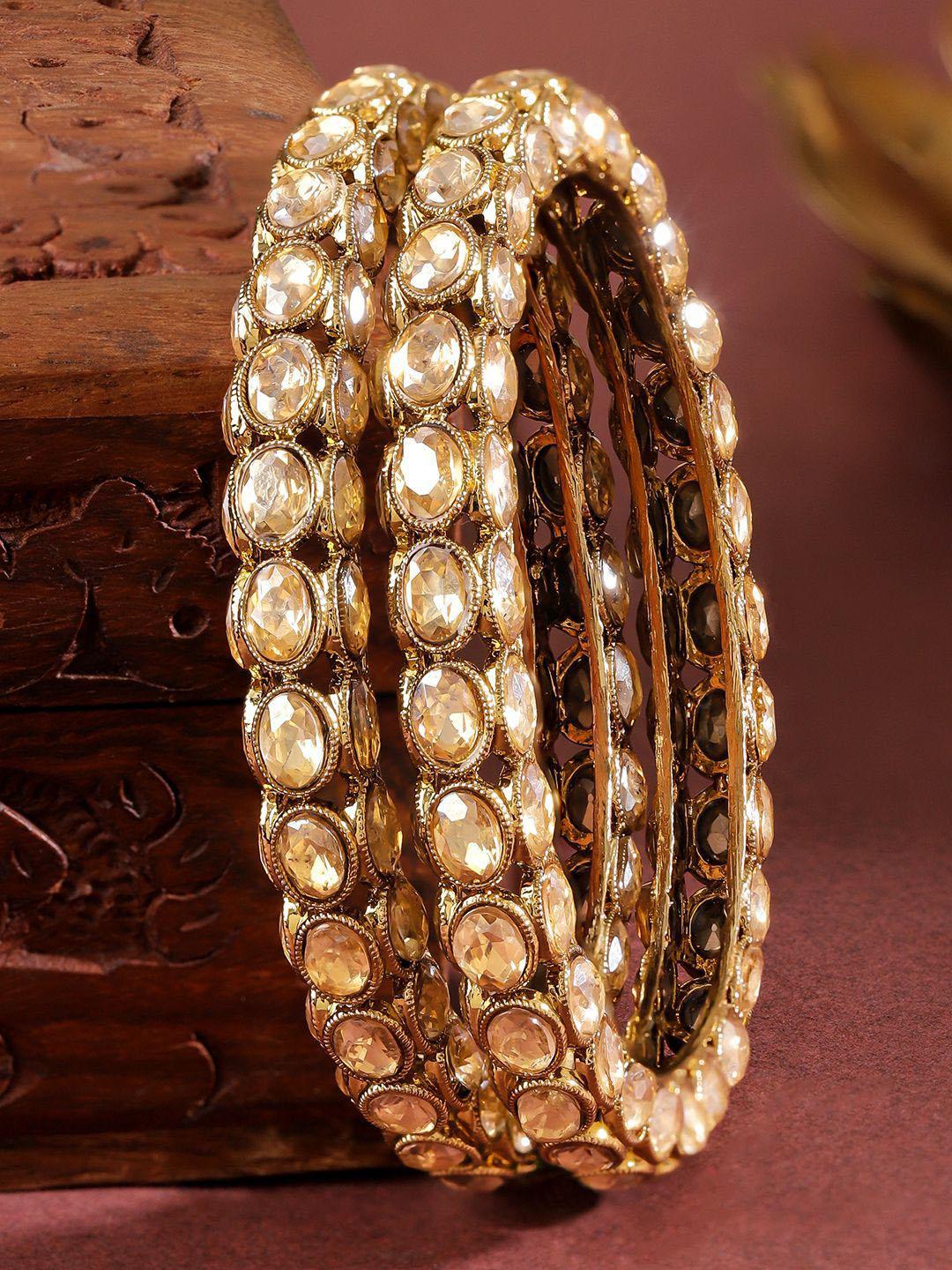 Buy Rubans Set Of 2 18K Gold Plated Light Gold Toned Cubic Zirconia Oval Studded Bangles - - Accessories for Women